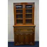 AN EDWARDIAN WALNUT AND OAK SECRETAIRE GLAZED DOUBLE DOOR BOOKCASE, three replacement wooden