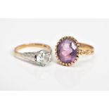 TWO GEM SET RINGS, the first set with an oval cut amethyst within a claw setting, detailed shoulders