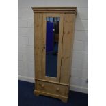 A SLIM VICTORIAN PINE MIRRORED SINGLE DOOR HALL ROBE above a single drawer, width 82cm x depth