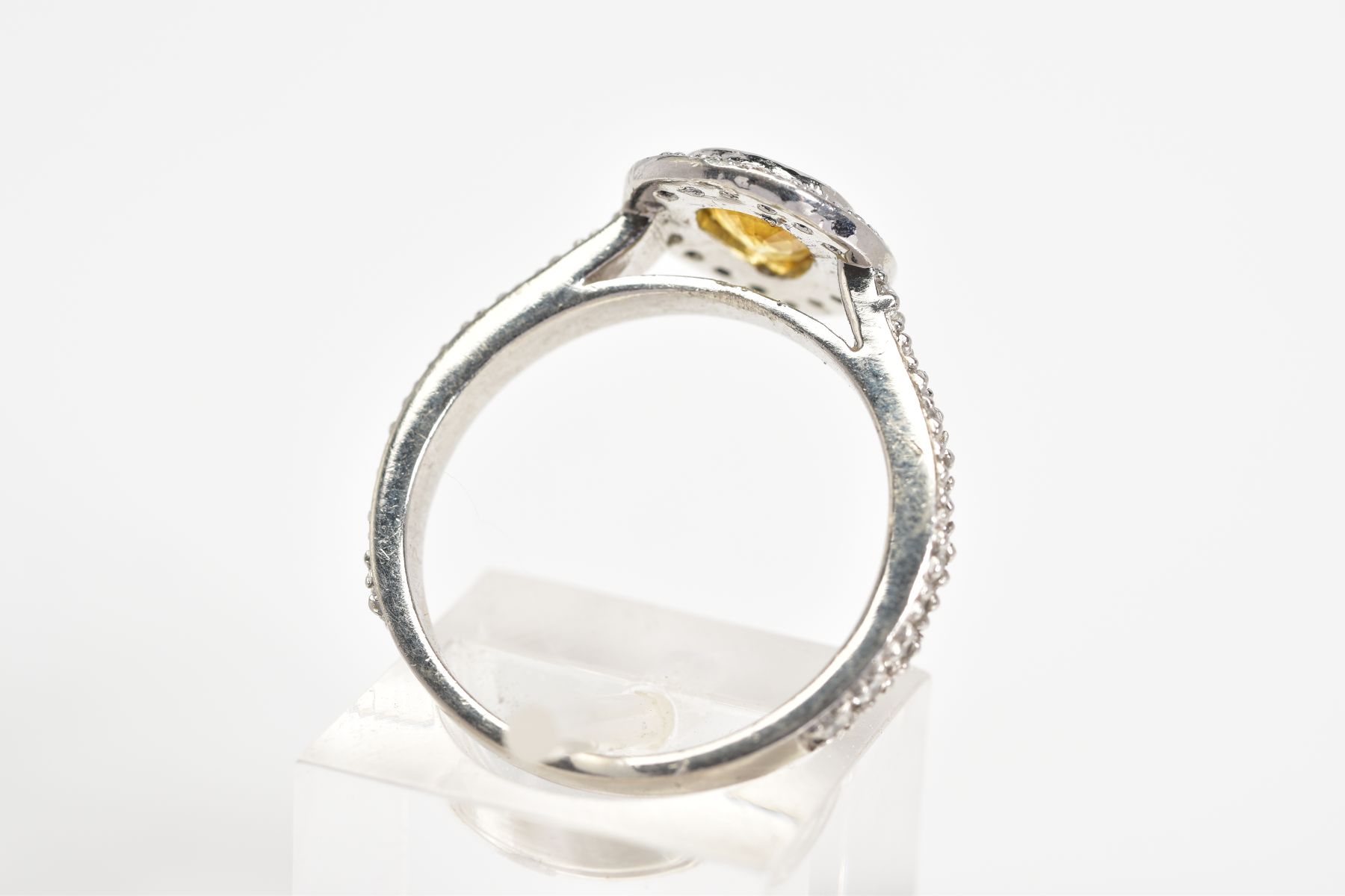 A YELLOW TOPAZ SET RING, the white metal ring set with a pear cut topaz with a round brilliant cut - Image 3 of 3