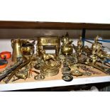 A GROUP OF BRASSWARE, to include a large brass trivet standing 30cm high, a fireside companion