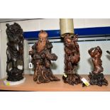 FOUR ORIENTAL CARVED HARDWOOD FIGURES, including two root carvings in the form of bearded men, the