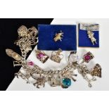A CHARM BRACELET WITH CHARMS, the curb link bracelet with sixteen charms such as crowns, bells, a