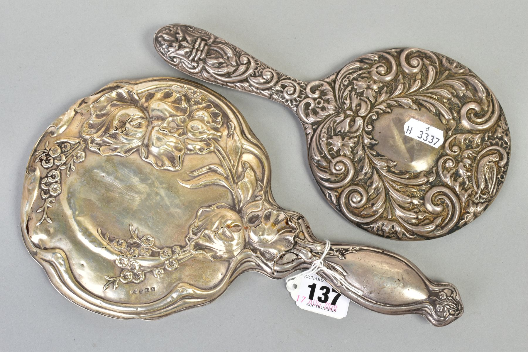 TWO SILVER MOUNTED HAND HELD MIRRORS, both with floral and foliate design, the first with an - Image 2 of 4