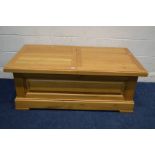 A SOLID LIGHT OAK COFFEE TABLE, with a double sliding top, length 132cm x depth 72cm x height 51cm