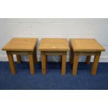A SET OF THREE SOLID LIGHT OAK OCCASIONAL TABLE, 50cm squared x height 55cm