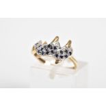 A 9CT GOLD SAPPHIRE AND DIAMOND RING, in the form of two over lapping dolphins, set with circular