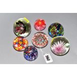 A GROUP OF SEVEN UNMARKED PAPERWEIGHTS, of which two Millefiori, two splatter glass and controlled