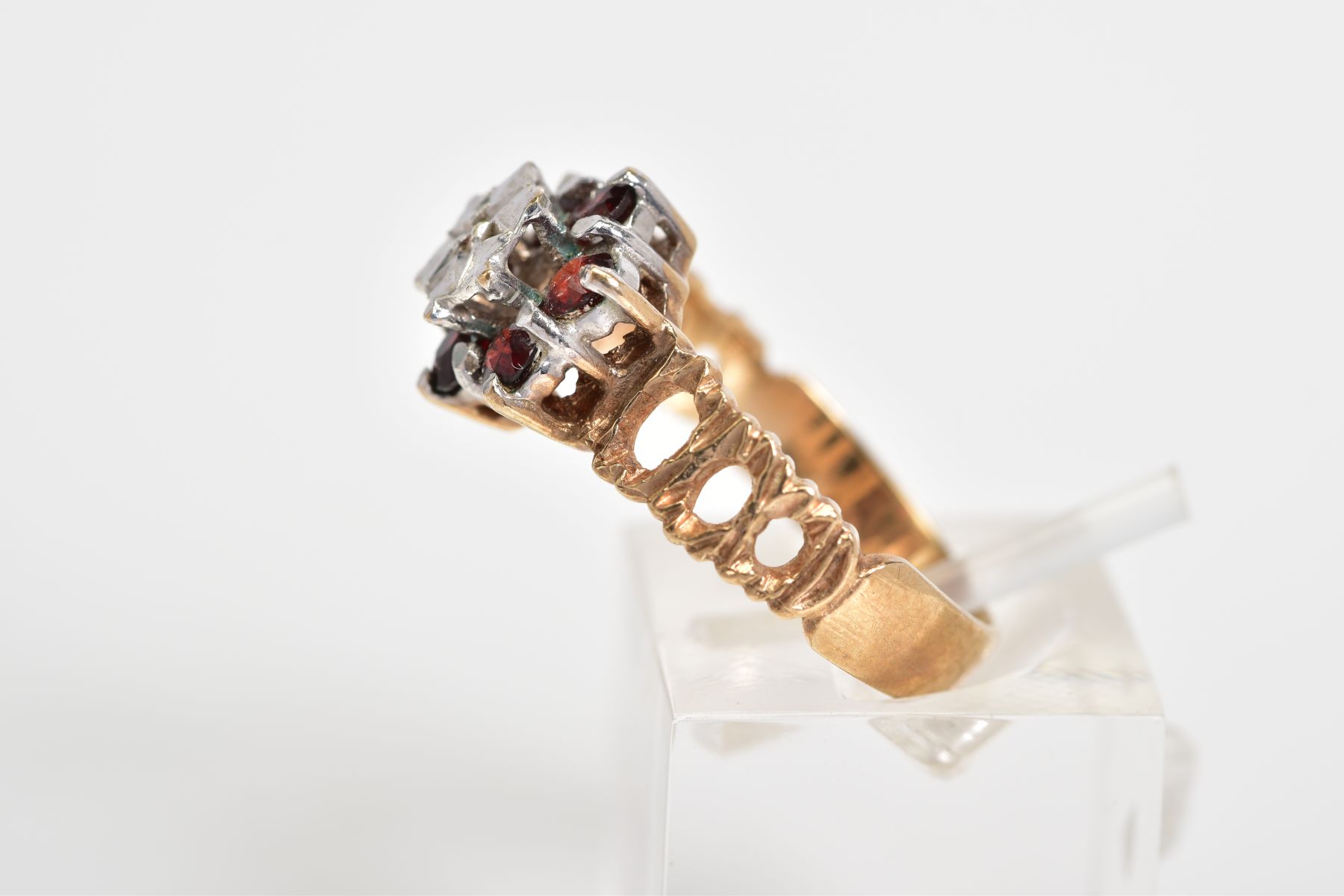 A 9CT GOLD CLUSTER RING, of tiered design set with a central single cut diamond, with a circular cut - Image 2 of 3