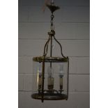 A BRASSED CYLINDRICAL HANGING LIGHT FITTING, with glazed sides and four internal branches,