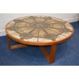 A CIRCULAR TRIOH OX ART DANISH TEAK COFFEE TABLE on a cross framed visible mortice and tenon joint