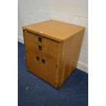 A LATE 20TH CENTURY OAK FINISH EXTENDING DESK, with two drawers and double cupboard doors, closed