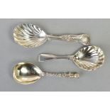 THREE SILVER CADDY SPOONS, to include a Victorian spoon with a cherub to the end of the handle and a