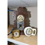 AN AMERICAN ANSONIA CLOCK CO DROP DIAL MANTLE CLOCK, having Roman numerals, in carved wooden case (