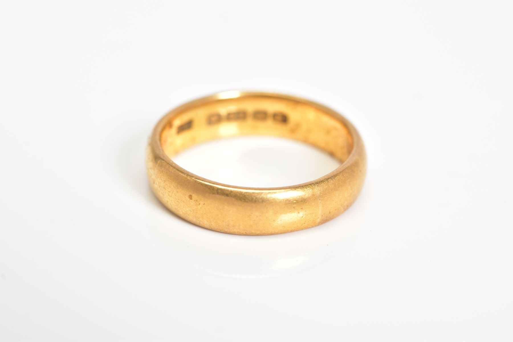 A 22CT GOLD WIDE BAND, the plain polished band with a 22ct hallmark for Birmingham, ring size K1/ - Image 2 of 2