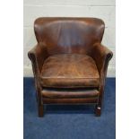A LATE 20TH CENTURY BROWN LEATHER CLUB CHAIR, with studded front armrests on oak legs, Halo label to