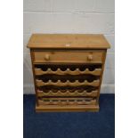 A MODERN PINE WINE RACK with a single drawer, width 77cm x depth 33cm x height 85cm