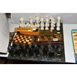 A MODERN RESIN CHESS SET, with medieval style chess men, together with cribbage boards, dominoes and