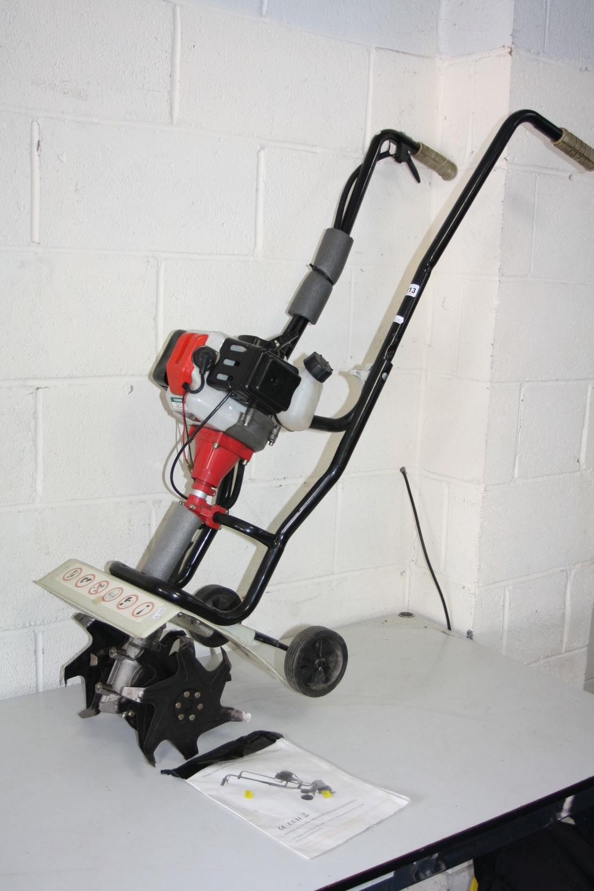 AN ECKMAN 2 STROKE PETROL GARDEN TILLER, with manual (we have seen it working along with a dated