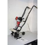 AN ECKMAN 2 STROKE PETROL GARDEN TILLER, with manual (we have seen it working along with a dated