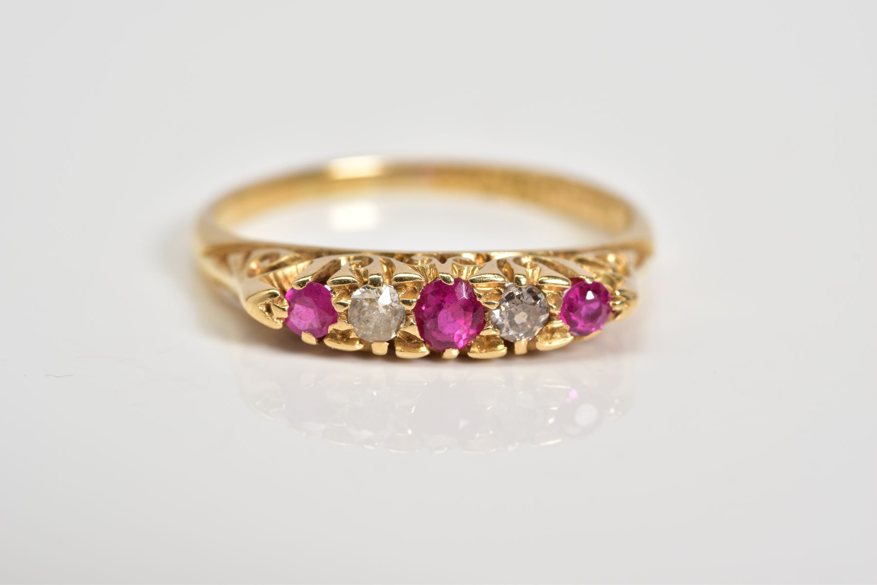 AN EARLY 20TH CENTURY 18CT GOLD RUBY AND DIAMOND RING, designed with three circular cut rubies - Image 4 of 4