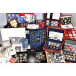 A LARGE BOX AND ALUMINIUM CASE OF UK AND WORLD COINS WITH ROYAL MINT SETS, STAMP AND COIN COVERS, to