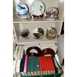 A QUANITY OF COLLECTORS PLATES AND A BOX OF PLATE FRAMES AND BOOKS, the plates include themes such