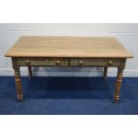 A LATE VICTORIAN PITCH PINE KITCHEN TABLE, with two drawers on turned legs, approximate width 161m x