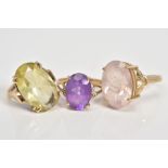 THREE 9CT GOLD GEM SET RINGS, the first an oval cut citrine within a double four claw setting and