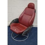 A RED AND BLACK LEATHER SWIVEL CHAIR, previously a car seat