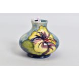 A MOORCROFT POTTERY SQUAT BALUSTER VASE, mottled blue ground with yellow/purple and pink/purple