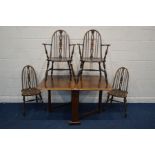 A SET OF FOUR MID 20TH CENTURY OAK SPINDLE HOOP BACK CHAIRS, including two carvers, together with an