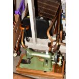 THIRTEEN WALKING STICKS, A CASED PORTABLE TYPEWRITER, a cased Jones manual sewing machine, boxed