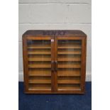 A TEAK GLAZED DOUBLE DOOR WALL HANGING DISPLAY CABINET, with later written Dinky, width 77cm x depth