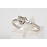 A GEM SET RING, the white metal ring set with a central heart cut cubic zirconia, to the plain