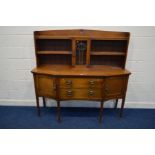 AN EARLY 20TH CENTURY OAK ARTS & CRAFTS SIDEBOARD, the top with shelves flanking a single lead