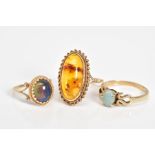 THREE 9CT GOLD GEM SET RINGS, to include an oval cut amber cabochon within a rope twist surround,