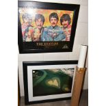 A FRAMED JIGSAW PUZZLE OF THE BEATLES, a framed Yann Arthus Bertrand 'Earth from Above' print and