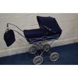 A VINTAGE SILVER CROSS DOLL'S FOLDING PRAM, with a matching handbag