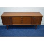 AN AVALON TEAK SIDEBOARD, with double sliding doors flanking three graduating drawers, approximate