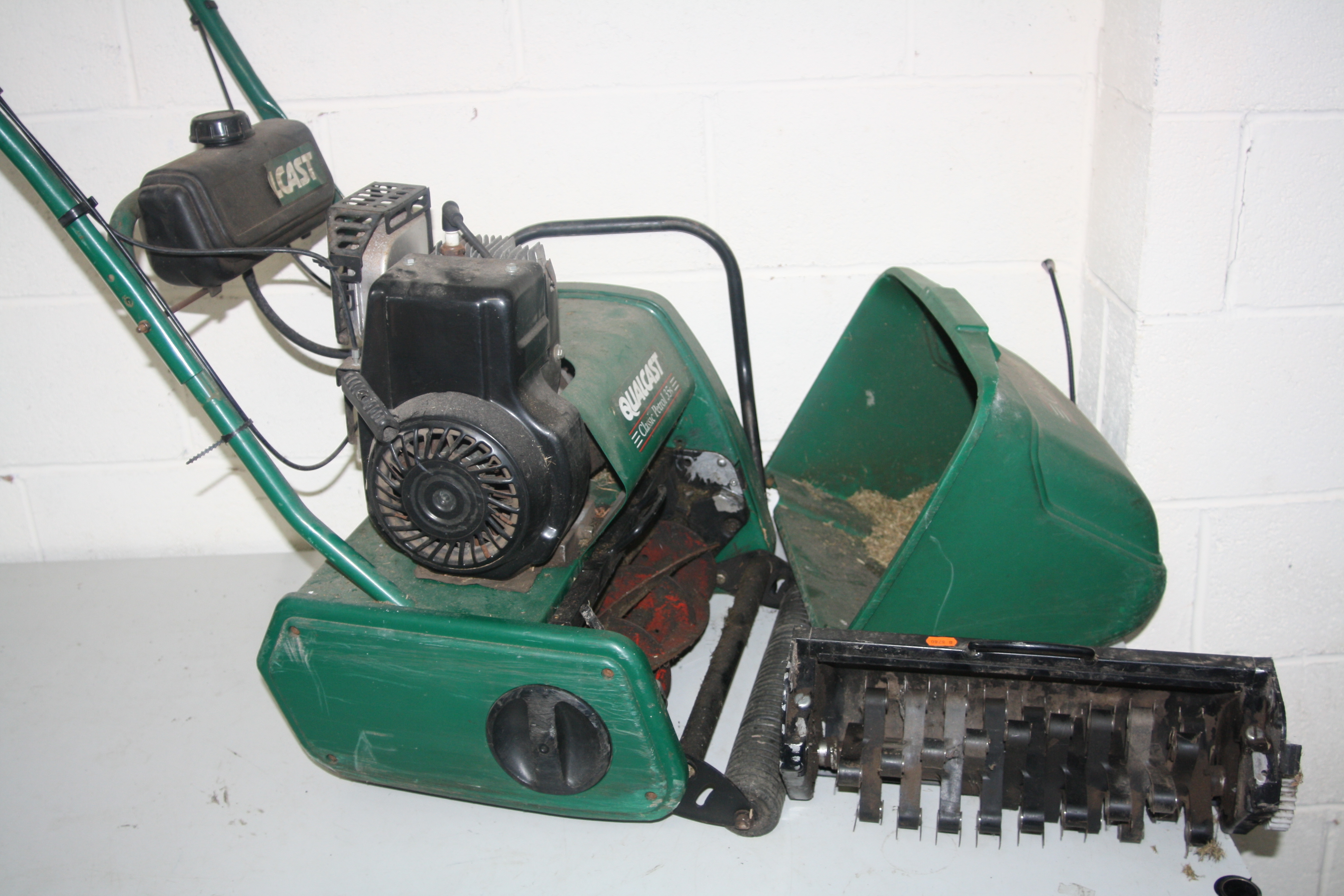 A QUALCAST CLASSIC PETROL 35S LAWN MOWER, (engine turning) with grass box and scarifier