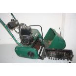 A QUALCAST CLASSIC PETROL 35S LAWN MOWER, (engine turning) with grass box and scarifier
