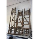 FOUR VINTAGE WOODEN STEP LADDERS, 2 x 152cm long, 1 x 141cm long and 1 x 185cm long