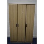 A MODERN TRIPLE DOOR WARDROBE, width 115cm x depth 56cm x height 197cm