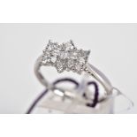 A DIAMOND CLUSTER RING, the cluster of bow shape design set with round brilliant cut and baguette