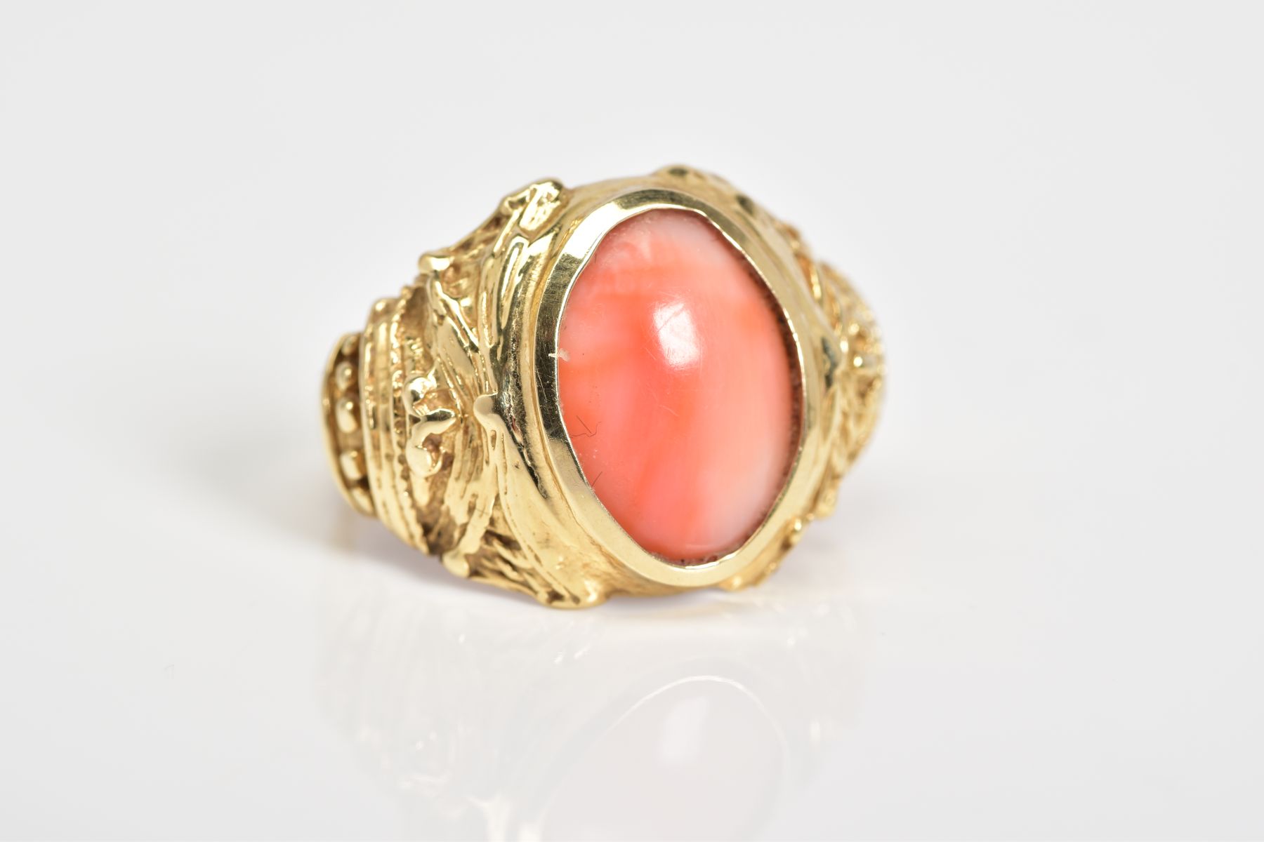 A CORAL SET RING, the yellow metal ring designed with a central oval coral panel within a collet - Image 4 of 4