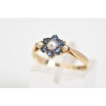 A 9CT GOLD CLUSTER RING, set with a central cultured seed pearl, with a circular cut sapphire
