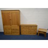 A MODERN GOLDEN OAK FIVE PIECE BEDROOM SUITE, comprising a two door wardrobe with four deep drawers,