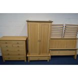A MODERN OAK THREE PIECE BEDROOM SUITE, comprising a double door wardrobe above a single drawer,