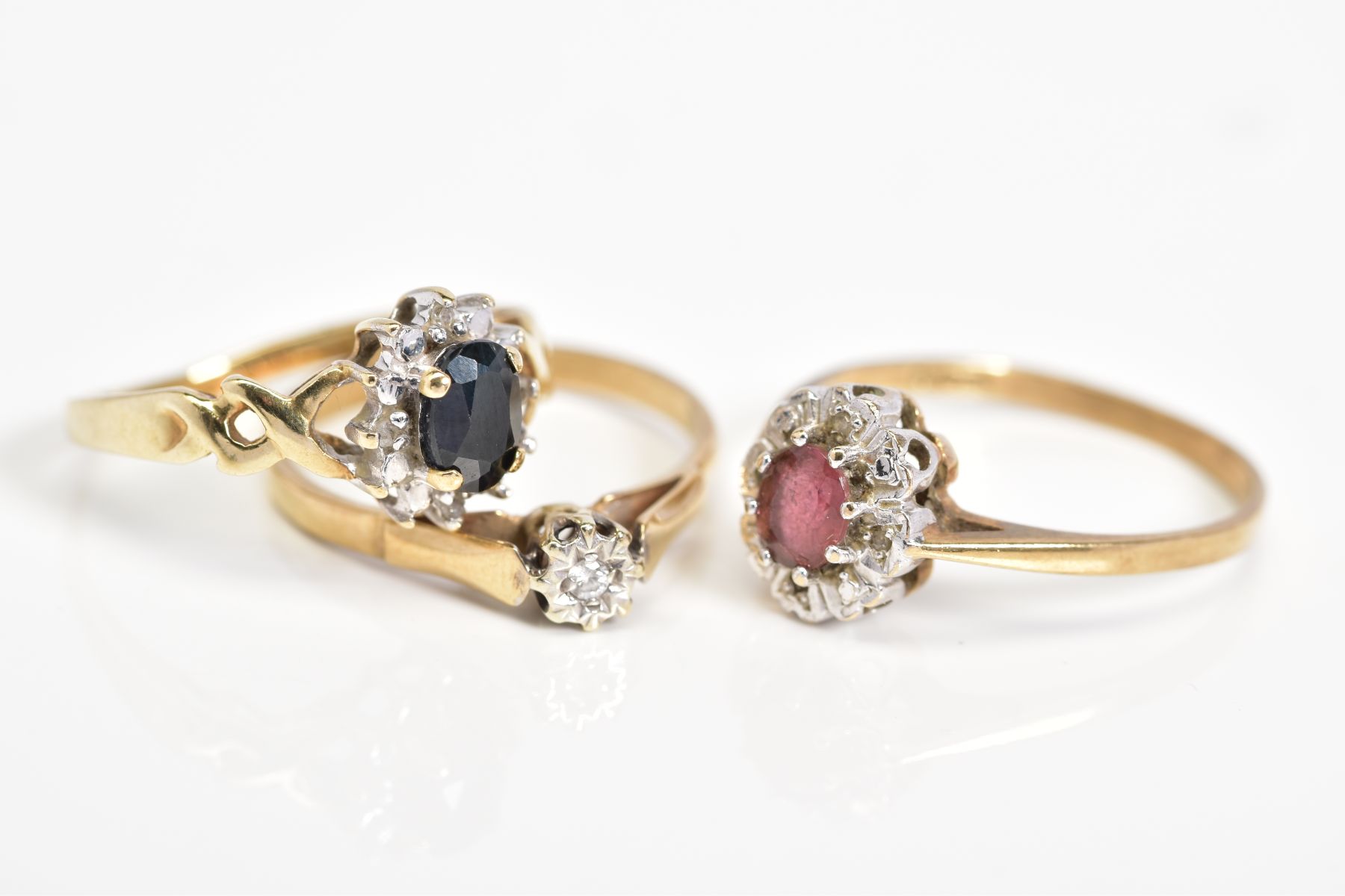 THREE 9CT GOLD RINGS, to include an oval cut sapphire and single cut diamond detail surround, with - Image 2 of 3